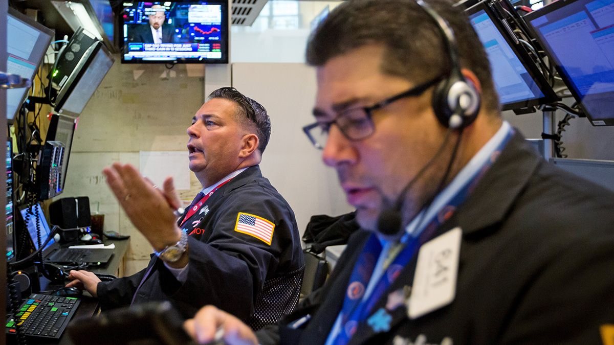 US traders look at screens on the floor of New York's stock exchange.